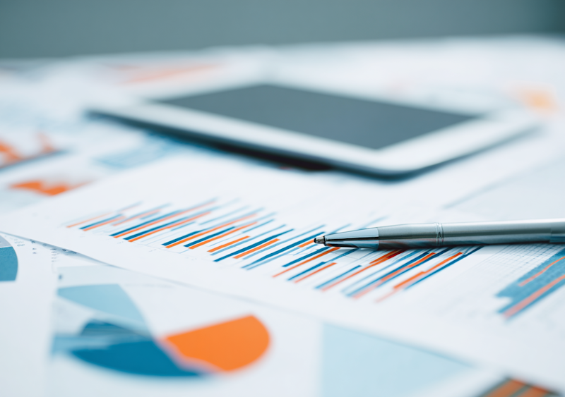 Budgeting calculator and financial planning documents on desk